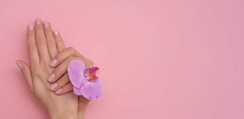 Obraz na płótnie Canvas Natural manicure on pink background.
