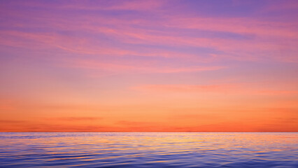 Colorful dramatic sunset sky background over sea with beautiful pink sunrise clouds and light reflection on water surface in the evening after sundown. Idyllic twilight seascape view