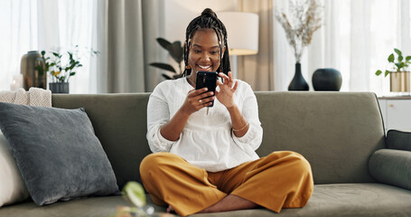 Home, funny and black woman on a sofa, cellphone and connection with social media, comedy post and laugh. African person, apartment or girl on couch, smartphone or mobile user with humor or typing - obrazy, fototapety, plakaty