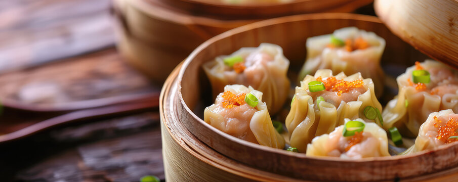 Assorted different Dim Sum in Bamboo Steamers bowl. Close-up of various dim sum in bamboo steamers, ready to serve.