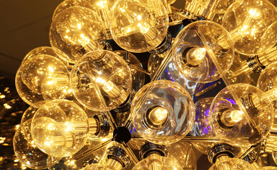 Close-up hanging light bulb pattern background.