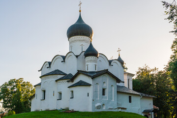 Pskov, Russia, September 6, 2023. Orthodox church illuminated by the setting sun.