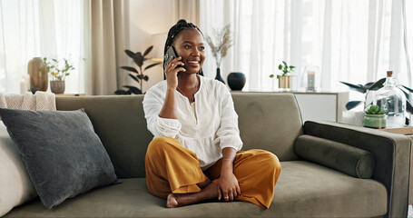 Funny, phone call and black woman on sofa, talking or communication at home. Smartphone,...