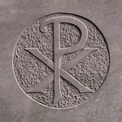 Old Chi-Rho sign (Christogram) carved with stone
