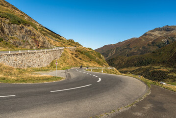 Winding pass road at Oberalp Pass, a mountain pass between the cantons of Graubuenden and Uri in...