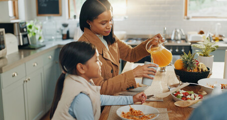 Woman, girl and juice with family and eating together in kitchen, nutrition and bonding with food....