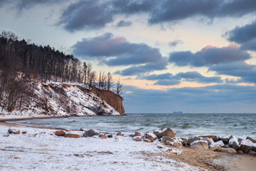 Winter landscape of Baltic Sea coast in Gdynia Orłowo at sunrise, Baltic Sea. Poland