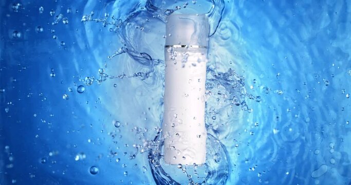 Super slow motion macro of unbranded cosmetic skincare moisturising beauty tall product bottle with dispenser and tap is falling into clear pure water with splashing waves and drops at 1000 fps