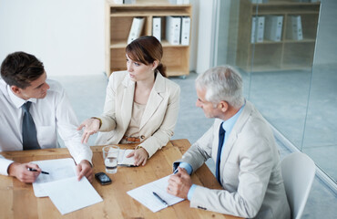 Obraz premium Business people, boardroom and corporate conversation or paperwork or lawyer teamwork, problem solving, solution. Men, woman and planning in office firm for legal advice or briefing, decision or deal