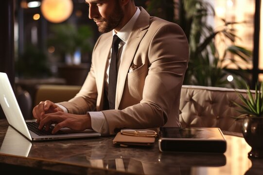 Businessman Working On Laptop In Cafe