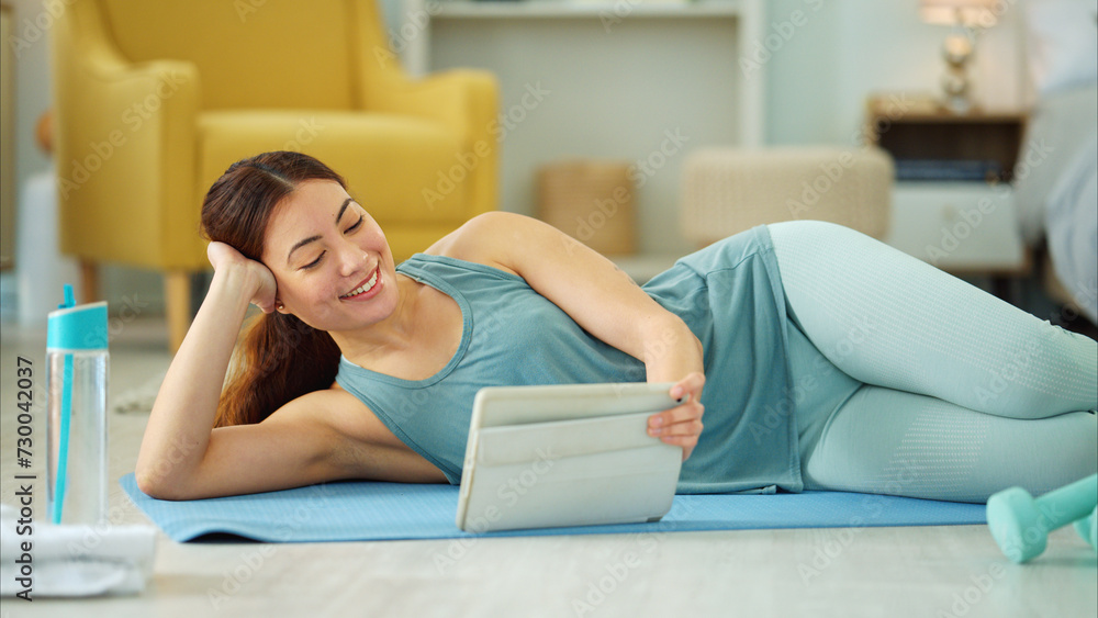 Canvas Prints Fitness, internet and woman streaming on a tablet for training, yoga and exercise on the floor of her house. Happy, young and wellness girl with technology for a workout, cardio or video on pilates