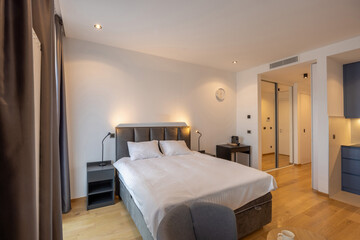 Fototapeta na wymiar Bedroom interior with large master bed