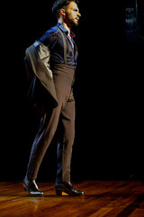 Confident stance of a male flamenco dancer, copy space.