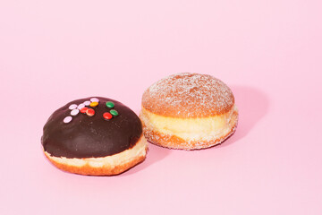 Traditional German Carnival Sweets  Berliner, Pfannkuchen or Krapfen in front of a colourful background