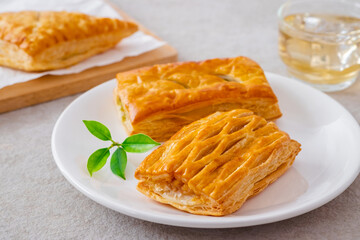 Baked puff pastry on white plate