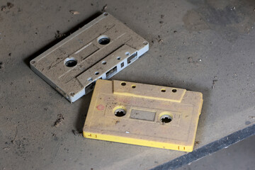Old cassette tape covered in dust Looking at it, I think of the old era.