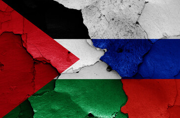 flags of Palestine and Russia painted on cracked wall