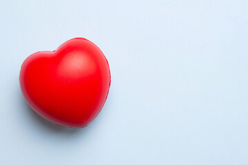 red heart shape on colored background. minimal concept top view with copy space