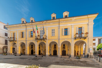 Fototapeta na wymiar Caraglio, Piedmont, Italy - the Town Hall building with arcades in Giolitti Square