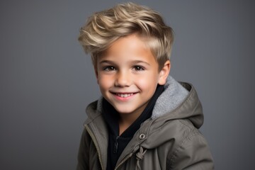Portrait of a cute little boy in a warm jacket. Studio shot.