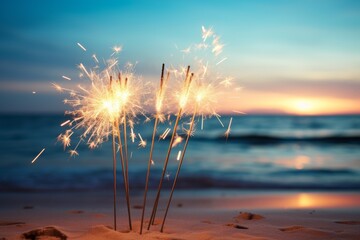 Sparklers on the beach at sunset.