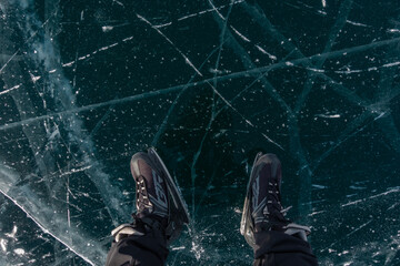 Skates on Transparent Cracked Ice