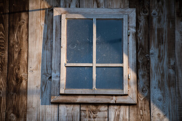 Croatia, October 20,2023 : Rustic style aged window at rural home wall.
