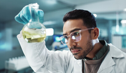 Man, scientist and shake beaker with chemical for research, experiment or test in lab. Science, serious or medical professional with glass for development of cure, biotechnology or study healthcare