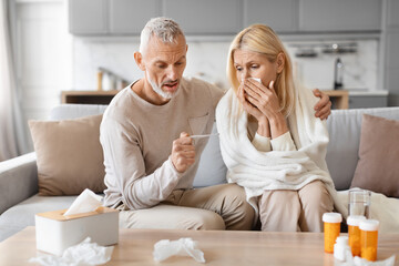 Loving retired man husband taking care of his sick wife