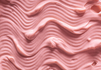 Face or body pink colored cream texture background