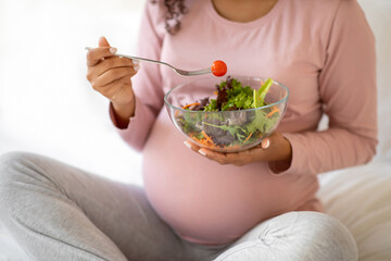 Cropped Shot Of Black Pregnant Lady Eacting Fresh Vegetable Salad At Home