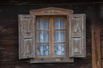 Croatia, October 20,2023 : Rustic style aged window at rural home wall.