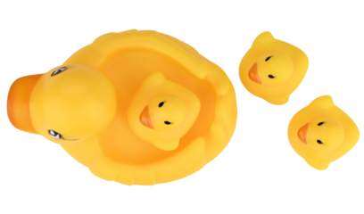 Toy yellow rubber duck with ducklings isolated on a transparent background. Top view.