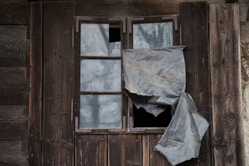 Croatia, October 20,2023 : Rustic style aged window at rural home wall.