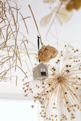 Bouquet of dry flower and grass hanging on wall, decoration in home
