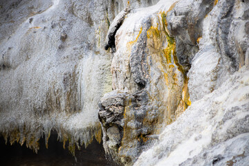 Fototapeta na wymiar gray and yellow stone texture at rotorua geyser in new zealand