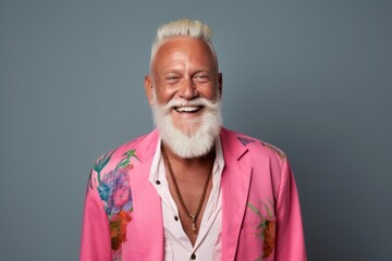 Portrait of happy senior man with long white beard and stylish hair.