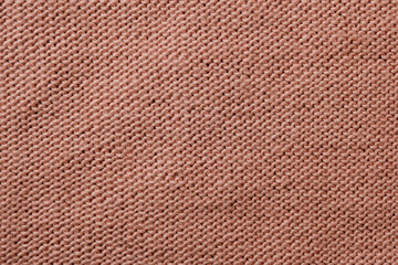 Texture of brown knitted wool fabric