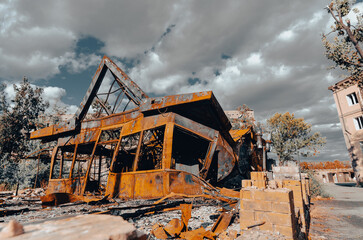 destroyed and burned houses in the city during the war in Ukraine