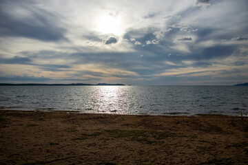 view from the beach to the sea in cloudy weather