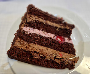 chocolate cake frosting for men. a marzipan plate on the side to indicate the year of birth. sliced...