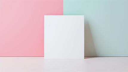 Blank white paper card on pink and blue background