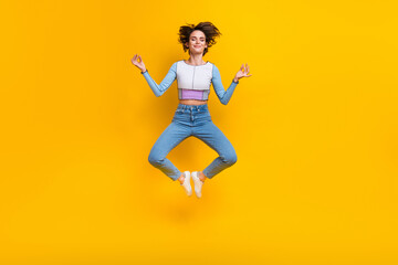 Fototapeta na wymiar Full length portrait of carefree pretty nice person jump flying meditate isolated on yellow color background