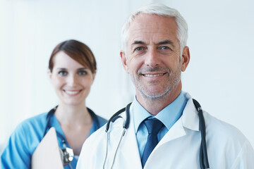Smile, portrait and doctor with nurse in hospital with clipboard for medical research in...