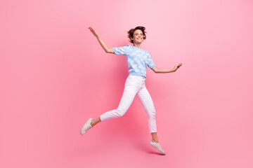 Full size portrait of cheerful gorgeous girl jumping flying have good mood isolated on pink color...