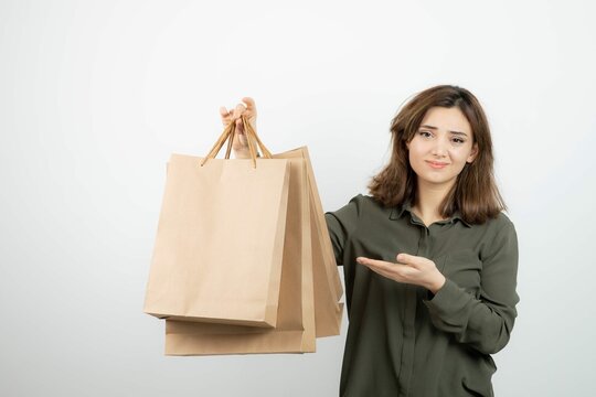 Portrait Young Woman Holding Paper Craft Bags Standing High Quality Photo