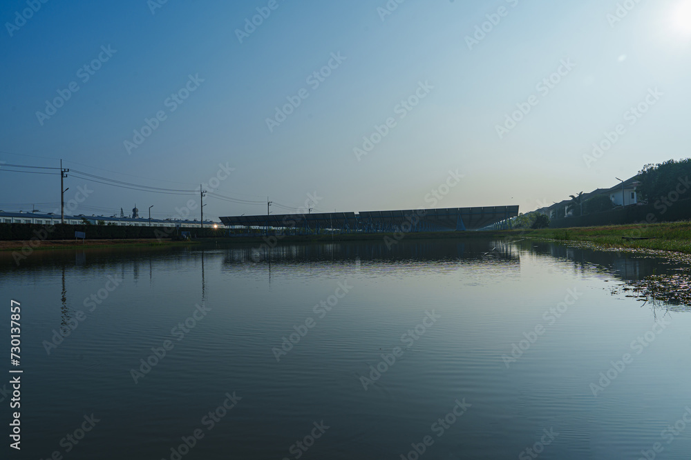 Sticker Solar Photovoltaic of solar farm view, solar plant rows array of on the water mount system Installation in earthen pond, water storage. Floating solar or floating photovoltaics (FPV)	
 - Stickers
