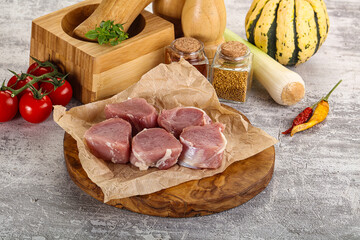 Uncooked raw pork tenderloin medallions