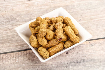 Raw ripe unpeeled peanut heap