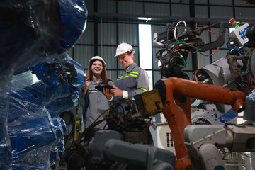 Industrial Technicians Analyzing Robotic Equipment